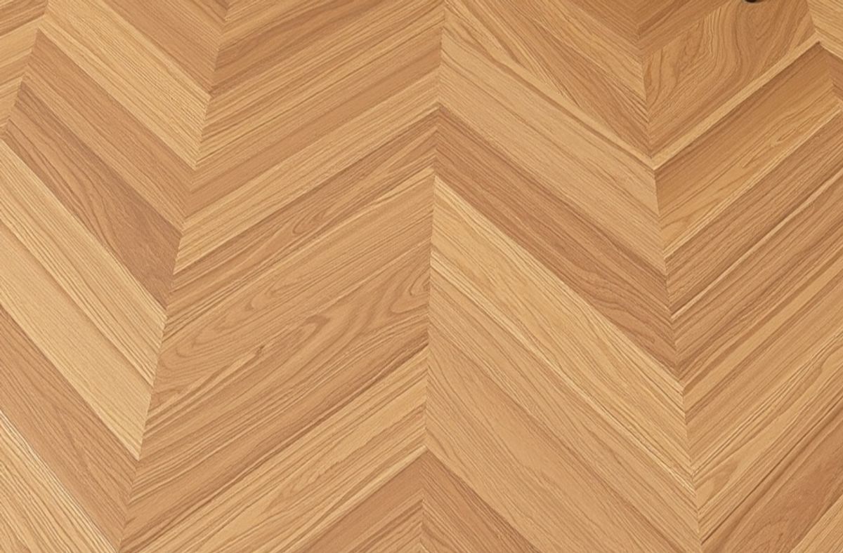 Herringbone hardwood flooring pattern in natural oak