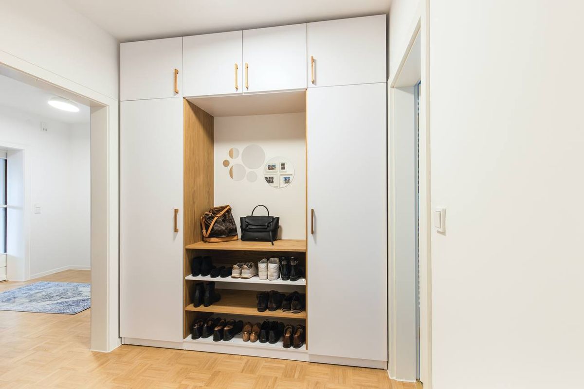 White built-in closet with shoe shelving and hanging space in a Vaughan entryway