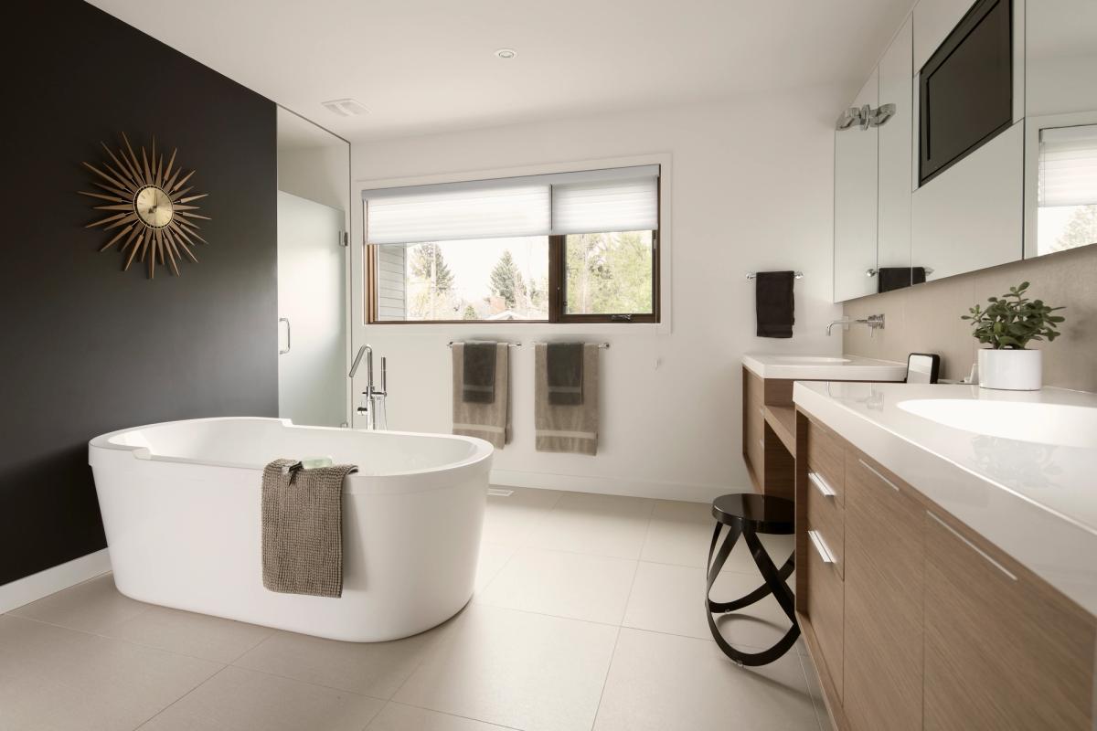 Bathroom with a freestanding tub and custom wall-hung vanity in a Vaughan home