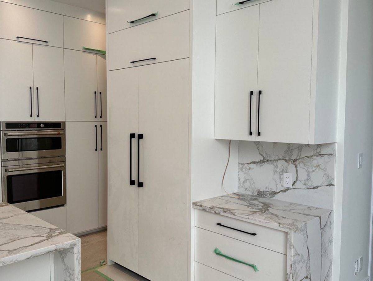 Custom laundry room cabinets by KABCO