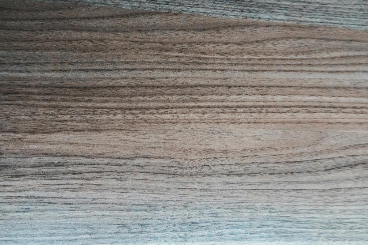 Close-up of dark wood-grain luxury vinyl plank flooring
